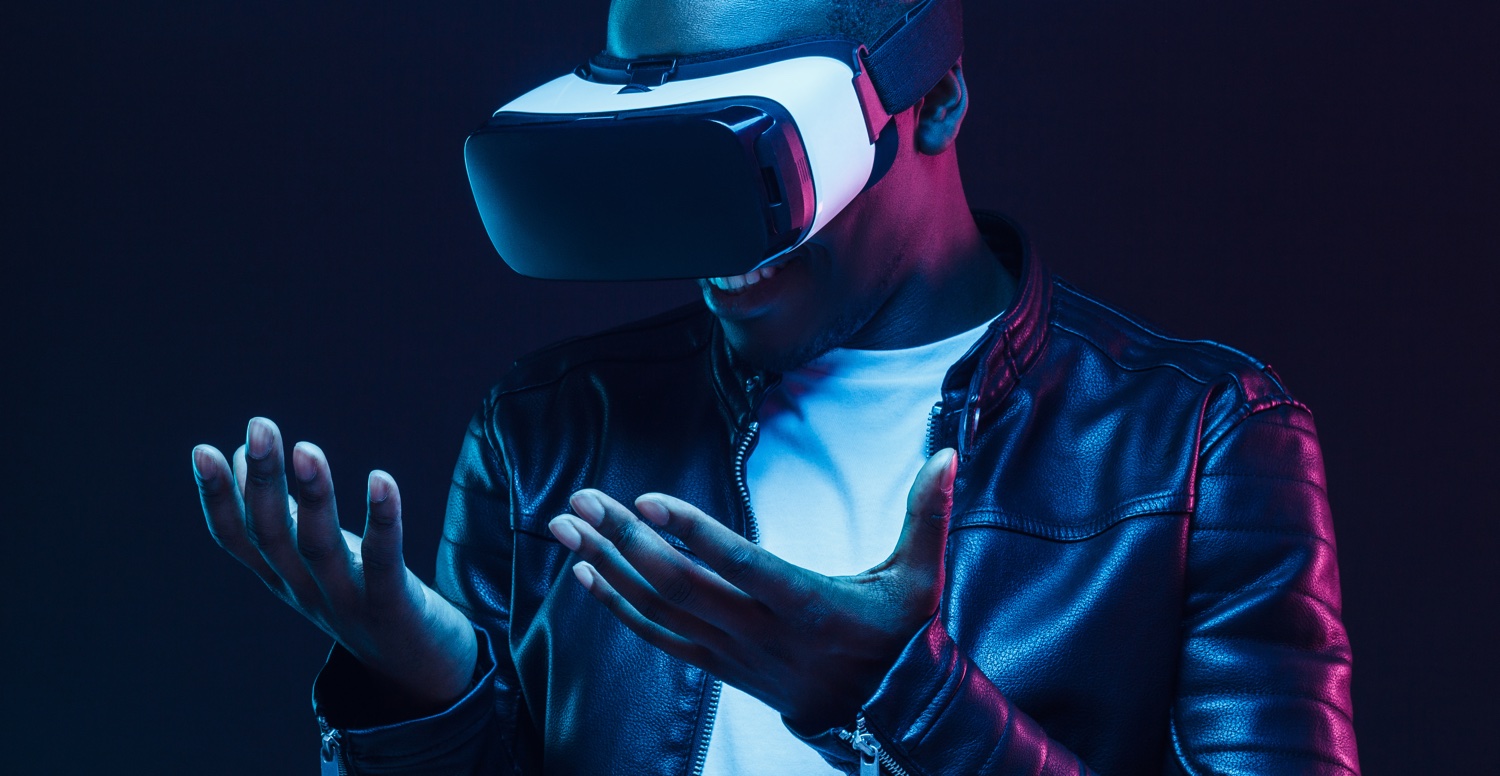 man smiling wearing vr goggles