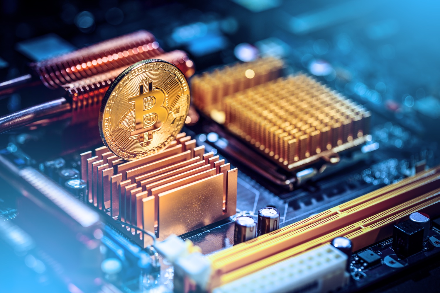 a bitcoin coin on a blue computer circuit